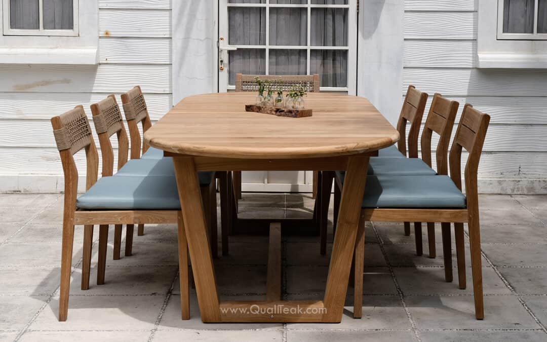 La Cana commercial teak dining table showing signature angled legs and 8-seat capacity.