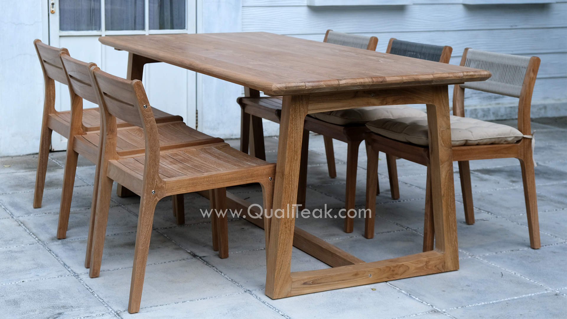 Fuego Outdoor Dining Table Set A commercial outdoor dining set featuring Fuego solid teak chairs around a matching rectangular teak table.